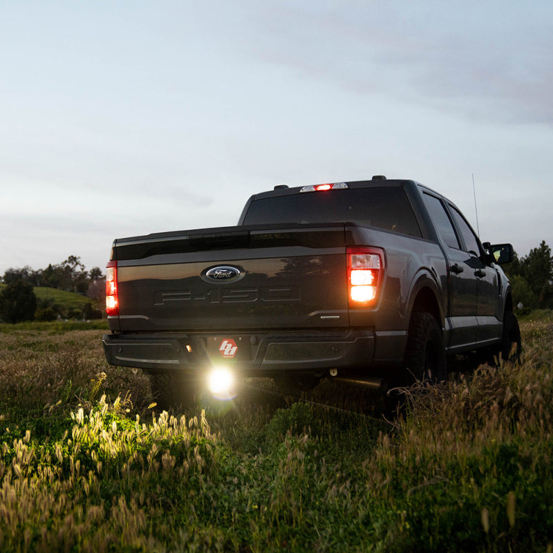 Baja Designs S1 Hitch Light Kit Toggle Switch - Universal on a Ford truck in a field at dusk.
