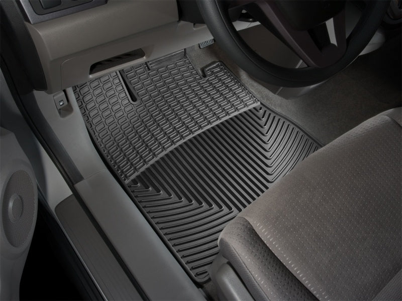 WeatherTech 93 Mercedes-Benz 300CE Front Rubber Mats - Black installed in a vehicle interior.