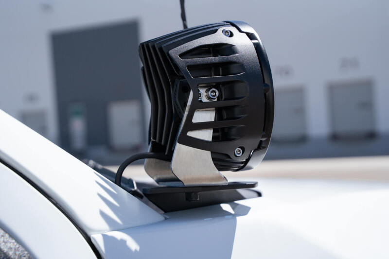 Addictive Desert Designs21-23 Ford Bronco/Raptor Dual Ditch Light Brackets mounted on a vehicle.