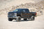 Fabtech 05-07 Ford F250/350 4WD 6in Coil Spring Kit - Black on off-road terrain