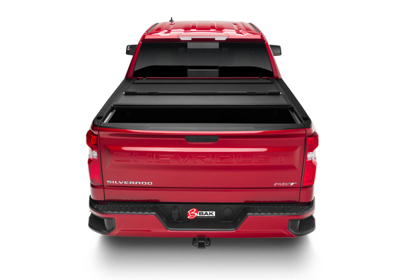 Rear view of BAK 19-21 GM Sierra 1500 (Carbon Pro Bed) 5ft 8in Bed BAKFlip MX4 Matte Finish truck bed cover.