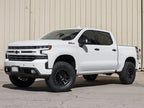 ICON 2019+ GM 1500 1.5-3.5in Stage 2 Suspension System w/Tubular Uca on a lifted white Chevrolet truck.