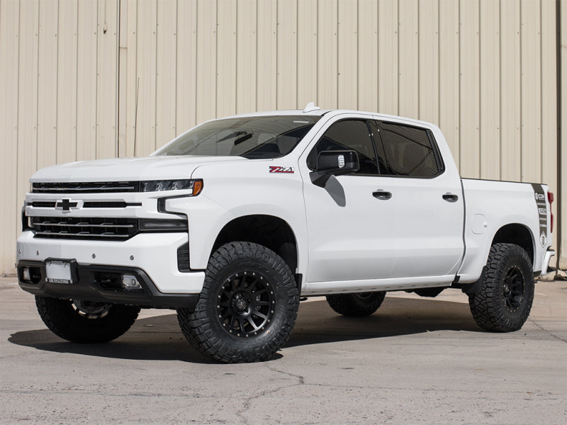 ICON 2019+ GM 1500 1.5-3.5in Stage 2 Suspension System w/Tubular Uca on a lifted white Chevrolet truck.