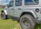 N-Fab Podium LG 2018 Jeep Wrangler JL 4DR SUV - Full Length - Tex. Black - 3in. with rugged tires and offroad accessories.