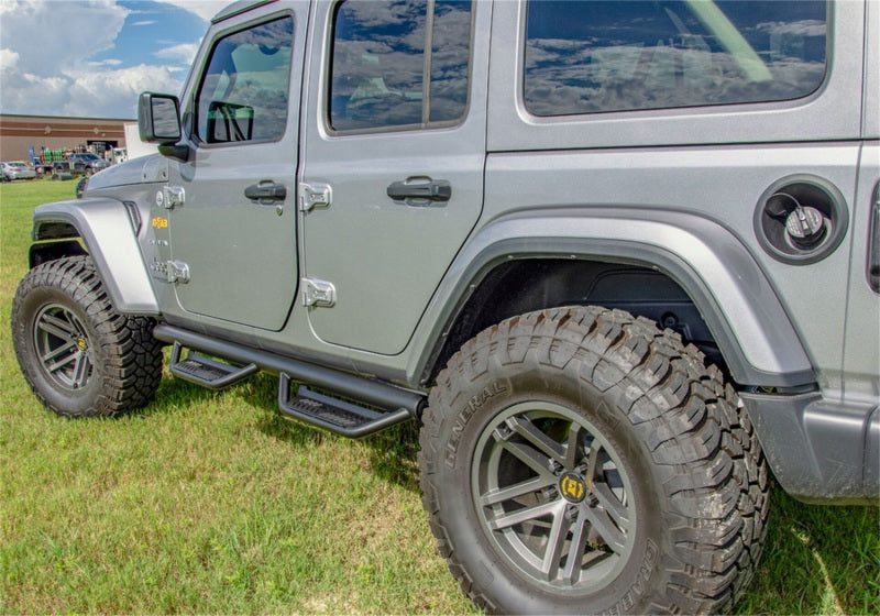 N-Fab Podium LG 2018 Jeep Wrangler JL 4DR SUV - Full Length - Tex. Black - 3in. with rugged tires and offroad accessories.