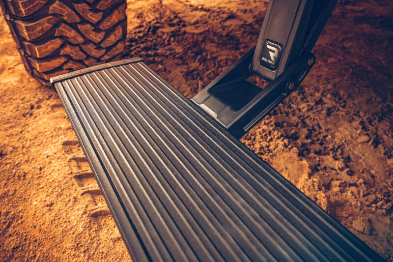AMP Research 2019 Ram 2500 PowerStep Plug N Play - Black close-up on textured step.