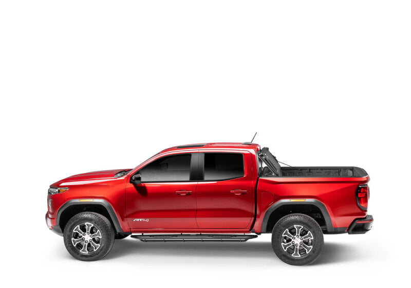 BAK 2024 Toyota Tacoma 6ft Bed BAKFlip MX4 Bed Cover on red truck