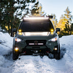 Rigid Industries 360-Series SAE Fog Yellow/White Pair on offroad vehicle in snow