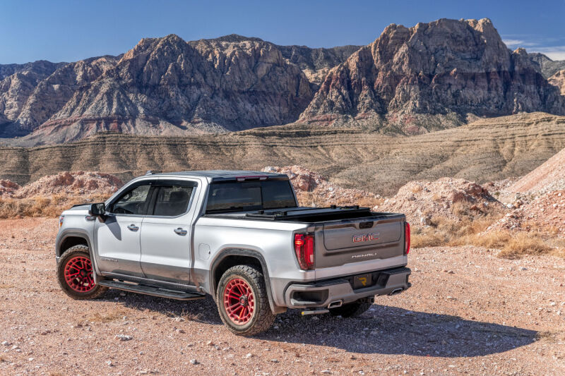 AMP Research 19-22 Chevrolet/GMC Silverado/Sierra 1500 BedStep - Black on rugged terrain