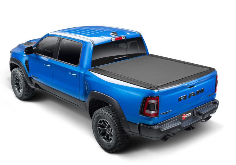 BAK 09-18 1500 Dodge Ram (19-20 Classic) w/o Ram Box Revolver X4s 5.7ft Bed Cover on blue truck