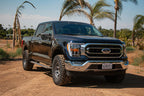 ICON 2021+ Ford F-150 4WD 0-2.75in Front 2.5 Series Shocks VS RR CDCV Coilover Kit on truck off road.