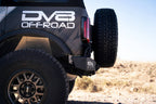 DV8 Offroad 21-22 Ford Bronco MTO Series Rear Bumper with offroad tires and exterior accessories.