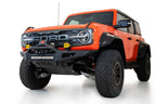 Addictive Desert Designs 22-23 Ford Bronco Raptor Rock Fighter Skid Plate on rugged offroad truck with performance upgrades.