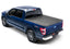 BAK 21-22 Ford F-150 (Incl. 2022 Lightning) Revolver X2 5.7ft Bed Cover on a blue truck with 4x4 emblem.