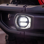 Rigid Industries 360-Series 4in LED SAE J583 Fog Light - White (Pair) installed on offroad truck bumper.