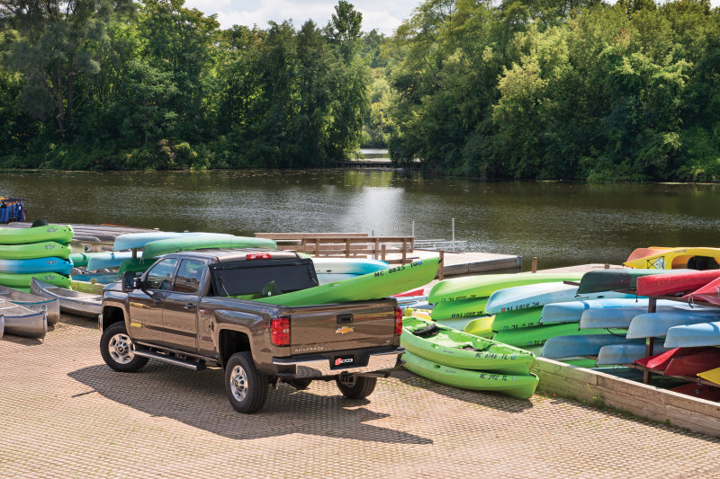 BAK 19-20 Dodge Ram (New Body Style w/o Ram Box) 5ft 7in Bed BAKFlip FiberMax with kayaks at the waterfront.
