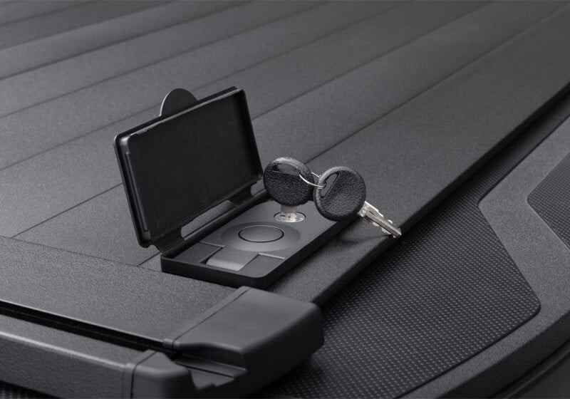 Retrax 2007-2020 Toyota Tundra CrewMax 5.5ft Bed RetraxPRO XR with Deck Rail System keys and latch close-up