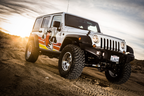 Fox 07-18 Jeep Wrangler JK 2.0 Performance Series 8.1in. TS Stabilizer 1 1/2in Tie Rod with offroad wheels