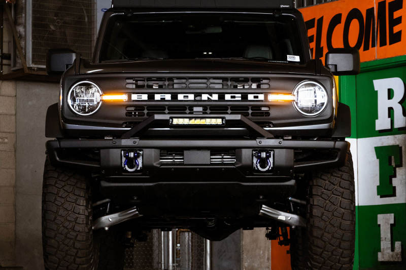 DV8 Offroad 21-22 Ford Bronco Factory Modular Front Bumper Bull Bar mounted on a black Ford Bronco.