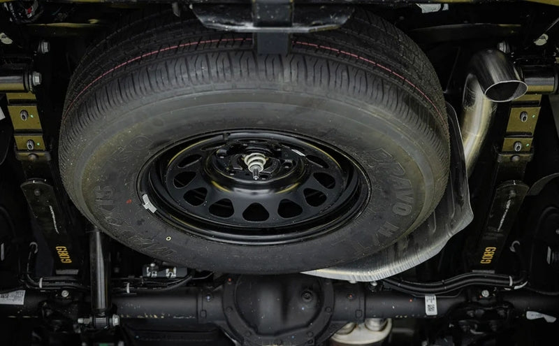 MagnaFlow 2023+ Chevy Colorado Overland Series Cat-Back Exhaust system image showing clear tire and exhaust layout.