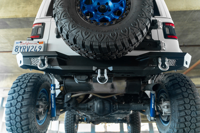 DV8 Offroad 2018 Jeep Wrangler JL MTO Series Rear Bumper w/ Optional Tire Carrier with 37-inch spare tire and offroad wheels