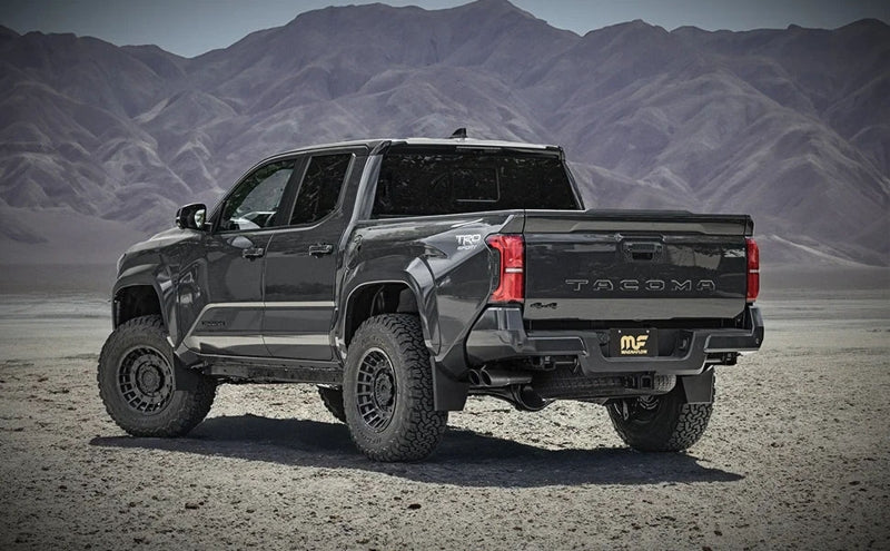 Magnaflow 2024 Toyota Tacoma Speq Series Cat-back Exhaust System (Black Tips) on offroad truck with black wheels