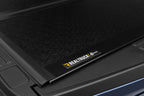 BAK 21-22 Ford F-150 (Incl. 2022 Lightning) BAKFlip FiberMax 5.7ft Bed Cover close-up with textured surface.