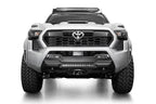 Addictive Desert Designs 2024 Toyota Tacoma Stealth Center Mount Winch Front Bumper with offroad lighting and aggressive design.