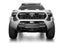Addictive Desert Designs 2024 Toyota Tacoma Stealth Center Mount Winch Front Bumper with offroad lighting and aggressive design.