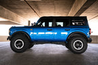 DV8 Offroad 21-22 Ford Bronco OE Plus Series Side Steps on blue Bronco