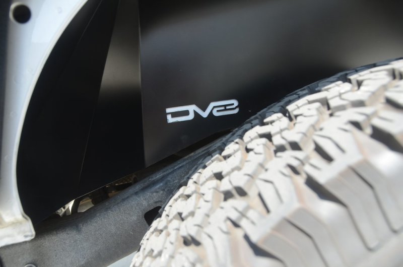 DV8 Offroad 07-18 Jeep Wrangler JK Rear Aluminum Inner Fender - Black close-up with tire.