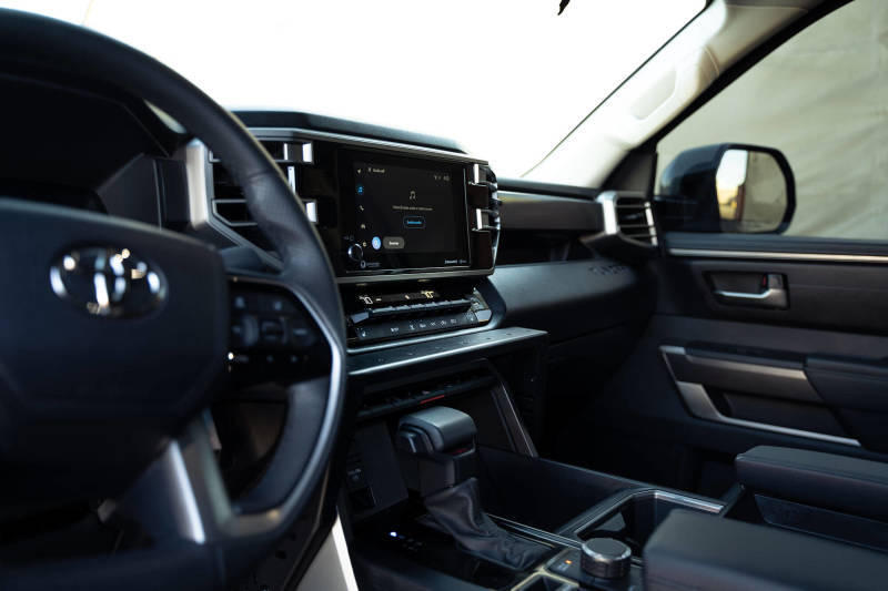 DV8 Offroad 22-23 Toyota Tundra Center Console Molle Panels/Device Mount interior view with controls and display.