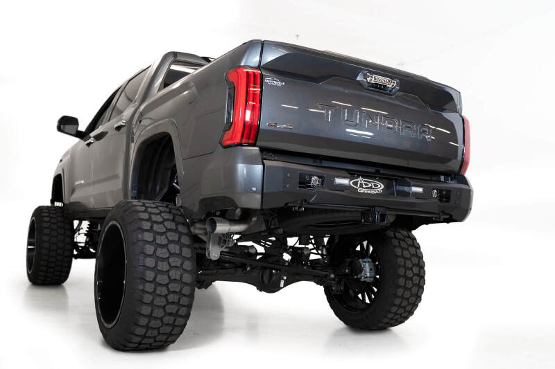 Addictive Desert Designs 22-23 Toyota Tundra Stealth Fighter Winch Rear Bumper on lifted truck with off road wheels
