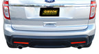 Gibson 11-18 Ford Explorer Base 3.5L 2.25in Axle-Back Dual Exhaust - Stainless installed on a silver Ford Explorer.