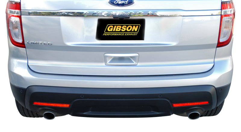 Gibson 11-18 Ford Explorer Base 3.5L 2.25in Axle-Back Dual Exhaust - Stainless installed on a silver Ford Explorer.