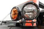 Addictive Desert Designs21-23 Ford Bronco/Raptor Dual Ditch Light Brackets with amber and clear lights for offroad lighting.