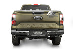 Addictive Desert Designs2024+ Ford Ranger Raptor Phantom Rear Bumper on truck, featuring offroad parts and upgrades.