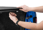 Person installing BAK 2023+ Chevrolet Colorado 5ft 2in Bed - Revolver X2 truck bed cover.