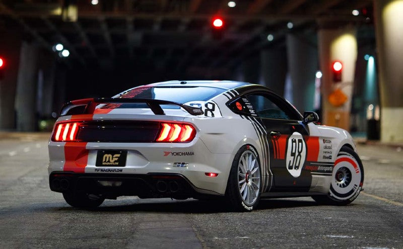 MagnaFlow 2017+ Dodge Charger 409 SS Polished 3in Quad Tips Cat-Back Exhaust on a modified car under urban lights.