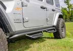 N-Fab Podium LG 2018 Jeep Wrangler JL 4DR SUV - Full Length - Tex. Black - 3in. side view with offroad tires and suspension.
