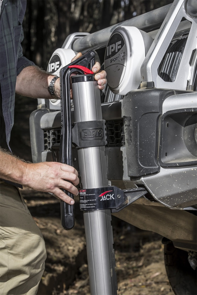Person using ARB Hydraulic Recovery Jack for offroad recovery
