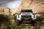 Body Armor 4x4 2014+ Toyota 4Runner HiLine Front Winch Bumper in off-road environment.