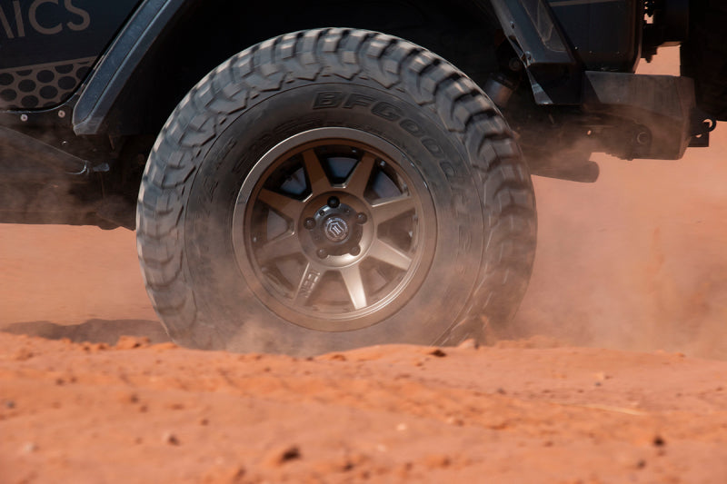 ICON Rebound Pro 17x8.5 6x5.5 0mm Offset 4.75in BS 106.1mm Bore Bronze Wheel in action on off-road terrain