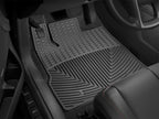 WT Rubber Mats - Rear - Blk in a vehicle floor with textured design.