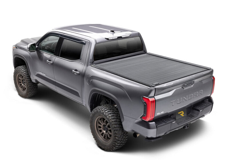 Retrax 2007-2020 Toyota Tundra CrewMax 5.5ft Bed RetraxPRO XR with Deck Rail System on offroad truck.