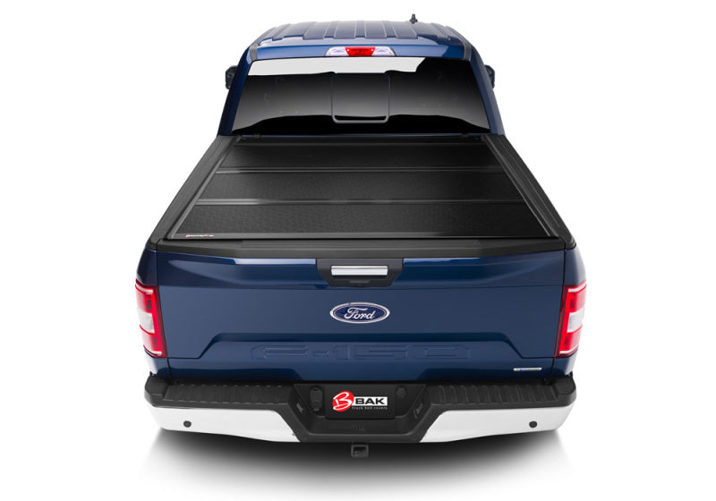 BAK 21-22 Ford F-150 (Incl. 2022 Lightning) BAKFlip FiberMax 5.7ft Bed Cover on a blue truck.
