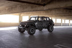 DV8 Offroad 07-23 Jeep Wrangler JK/JL & Gladiator JT FS-15 Series Front Bumper shown in parking garage.