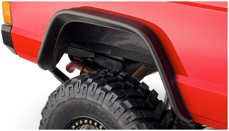 Bushwacker 84-01 Jeep Cherokee Flat Style Flares 4pc - Black on offroad tires
