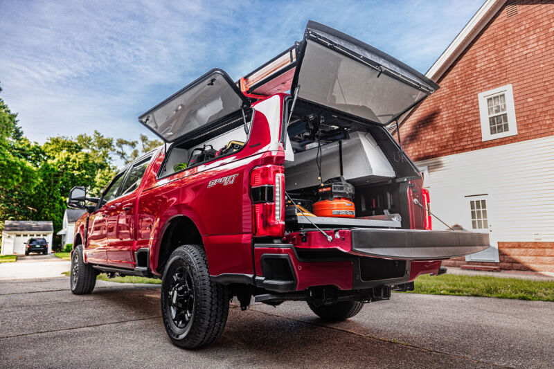 AMP Research 2023 Ford F-250 Super Duty BedStep - Black in action