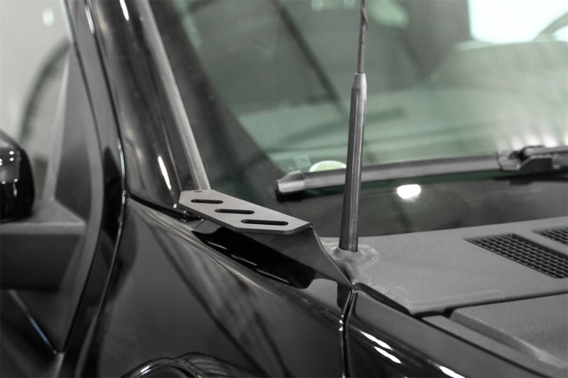 Addictive Desert Designs2021+ Ford F150 / 2021+ Ford F150 Raptor Ditch Light Brackets close-up on truck hood